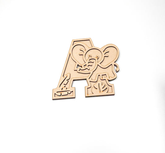 a wooden cutout of an elephant playing with a ball